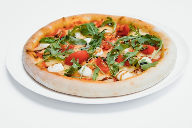 Mixed pizza from top isolated on white background clipping path included.