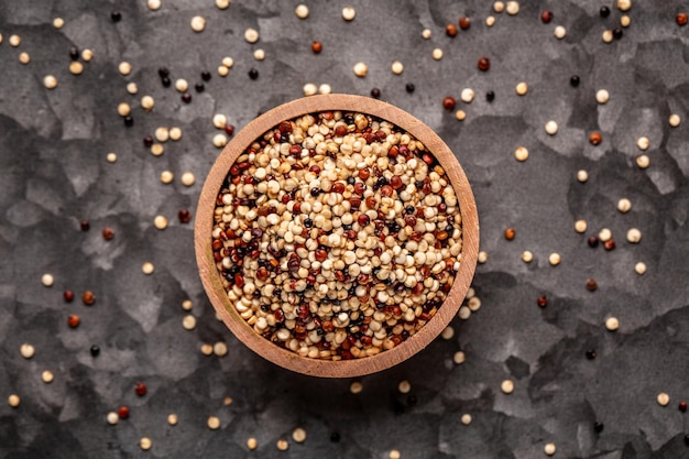 Mixed quinoa red white and brown quinoa in wooden bowl Healthy and gluten free food banner menu recipe place for text top view