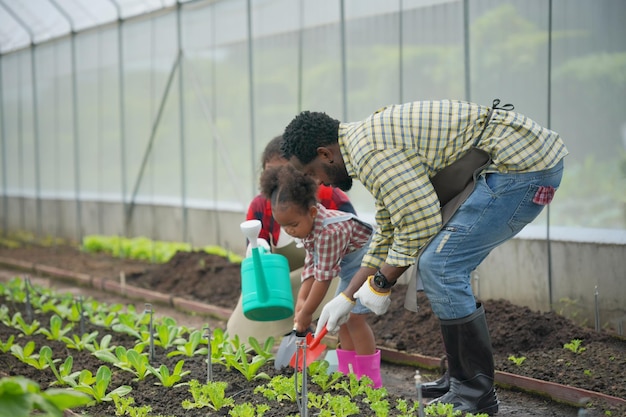 Mixed race family with daughter spending time together at organic's farm AfricanAmerican family