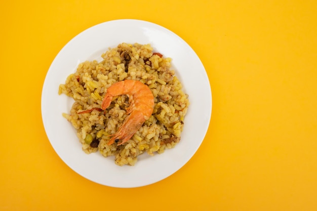 Mixed rice with seafood shrimp on small white dish