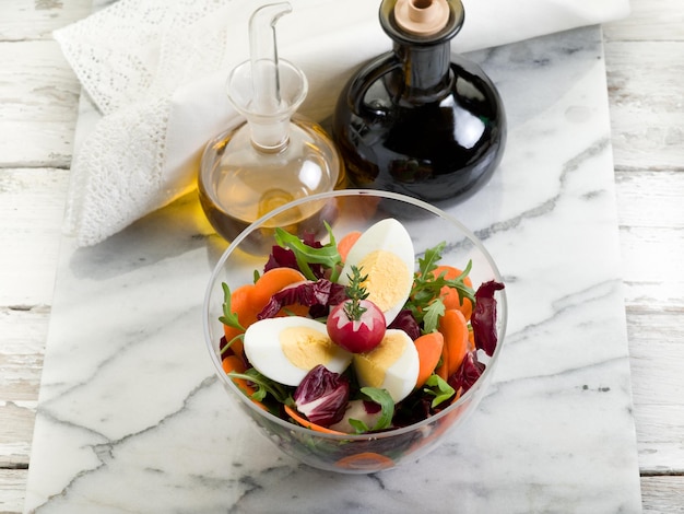 Mixed salad with arugula carrot and egg