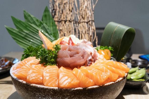 Mixed sliced sashimi on ice, japanese food in Asian restaurant