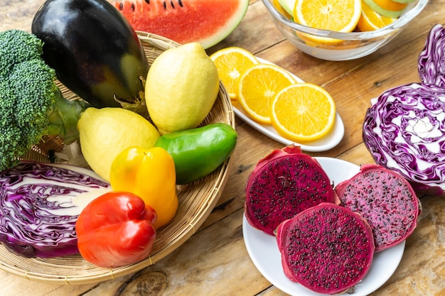 Mixed vegetables and fruits healthy diet food on wood table