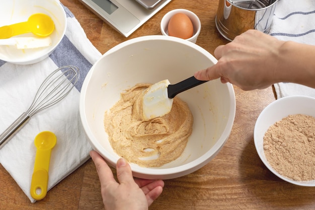 Mixing cookie ingredients in bowl for baking