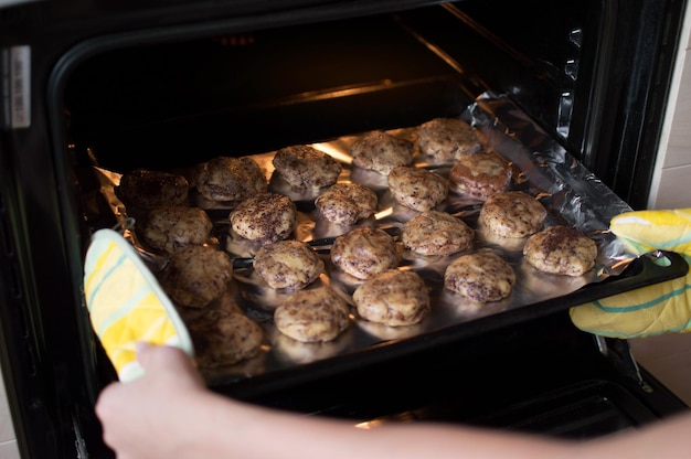 A mixture of baking dessert is placed on an iron pan in the oven