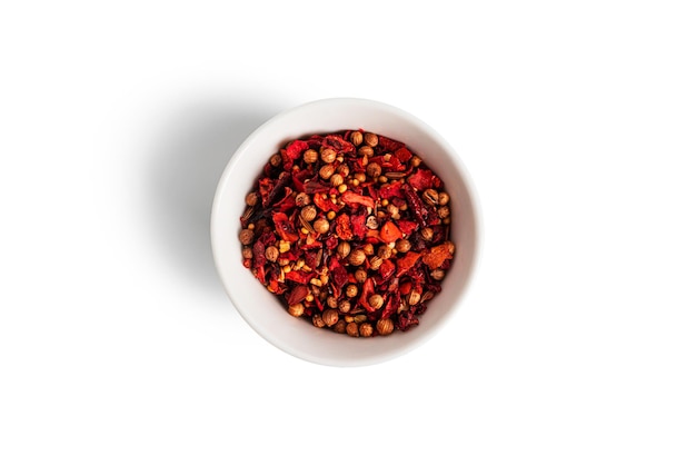 A mixture of peppers isolated on a white background The spice is a mixture of peppers