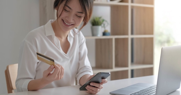 Mobile banking, Online shopping, digital banking, internet payment concept. Woman hand using mobile smart phone payments and credit card for online shopping