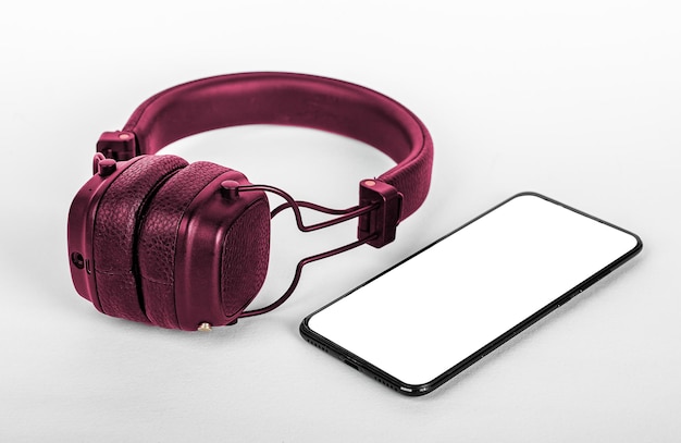 Mobile phone and headphones in perspective view Smartphone screen mock up display for audio music app ad promo