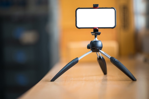 A mobile phone mounted on a tripod