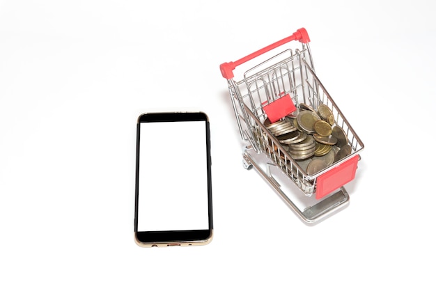 Mobile phone screen with coins in the tiny shopping cart