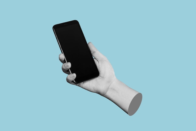 Mobile phone with black screen in female hand isolated on a blue color background Contemporary art