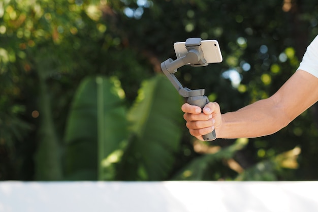 Mobile Smartphone Gimbal in the man hand.