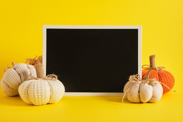 Mocap black sign and halloween decor on a bright yellow background