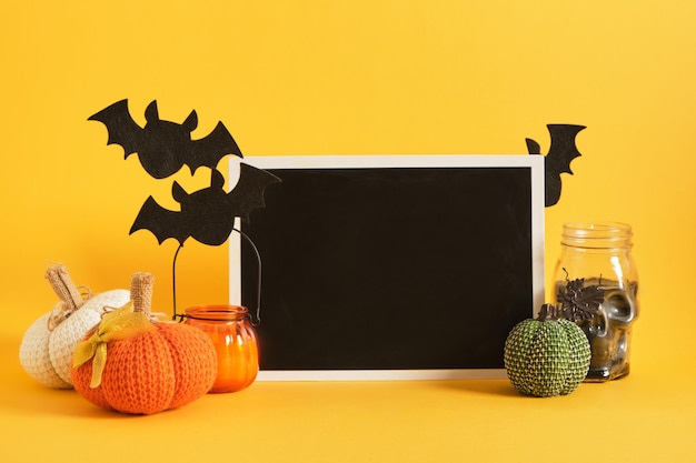 Mocap black sign and halloween decor on a bright yellow background