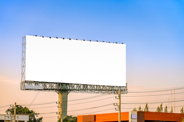 Mock up billboard canvas in city background with beautiful sunset.