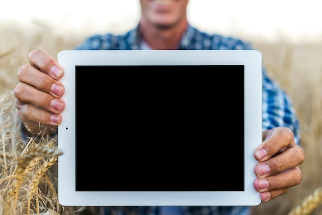 Mock-up man holding a tablet