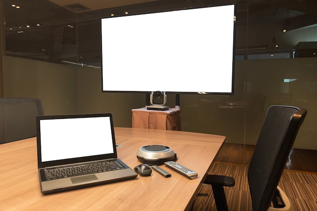 Mock up white screen display laptop and television in meeting room