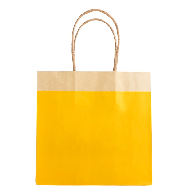 Mock up of a yellow kraft paper bag with a pen on a white background. Isolated object