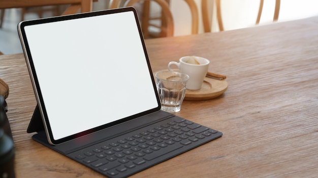 Mockup blank screen tablet on desk with copy space