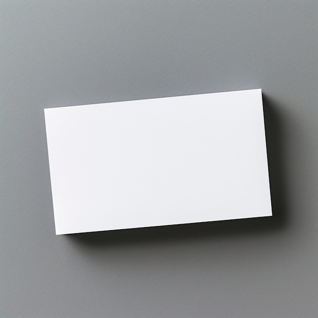 Photo a mockup of a blank white business card view from top grey background minimalism copy space