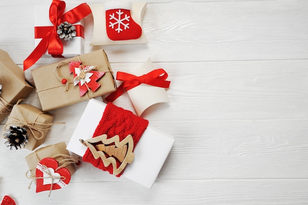 Mockup christmas boxes decorated stylishly on a white wooden 