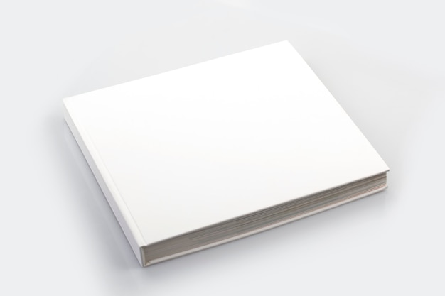 Mockup of closed blank square book at white textured paper background