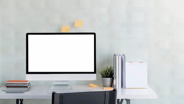 Mockup desktop computer monitor on white top table, blank screen for product display. Technology background.