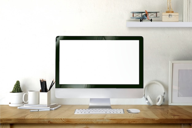 Mockup desktop computer on wooden desk.