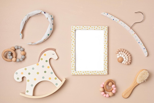 Mockup of empty frame with eco friendly baby accessories