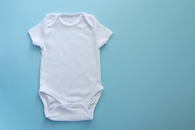 Mockup Flat Lay white bodysuit for on a blue background