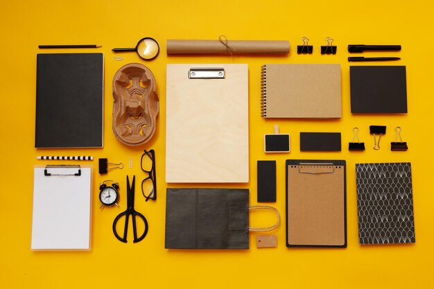 Mockup flat lay with different office accessories on yellow background