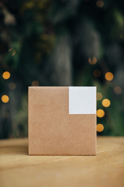 Mockup Kraft paper boxes with white stickers on Christmas background