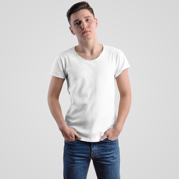 Mockup male t-shirt on a young guy on a white background, front view. Template fashion clothes for advertising design and presentation in the online store