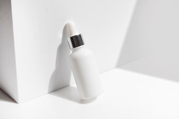 Mockup of medical skin care bottle cosmetic serum dropper beauty makeup facial treatment cleanser face