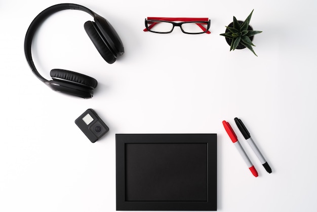 Mockup, Photo Frame, Action camera, Headphones, Glasses, Pen, and Cactus, Red and Black object on white background