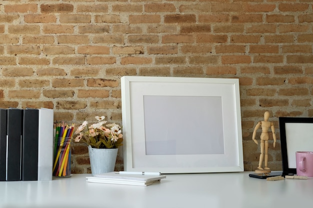 Mockup poster with home office supplies on white desk