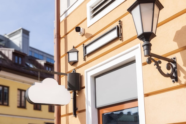 Mockup for title logo white sign in the form of a cloud on an old building