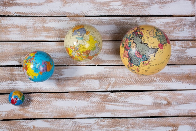 Model globes of planet earth on wooden background Preservation of the environment