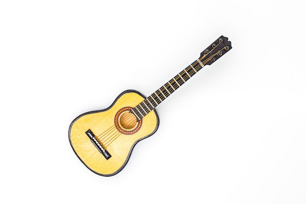 Model of guitar on a white background music instrument