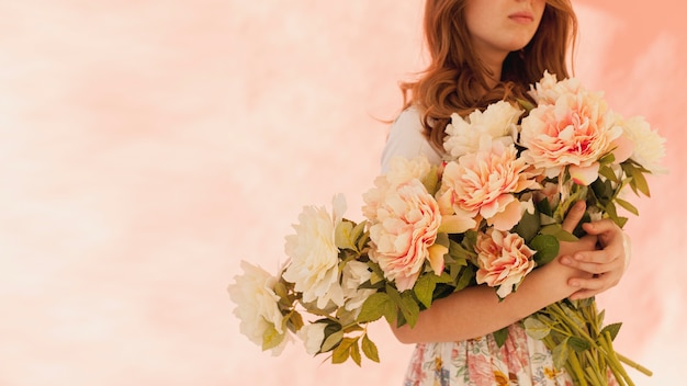 Model holding beautiful flowers