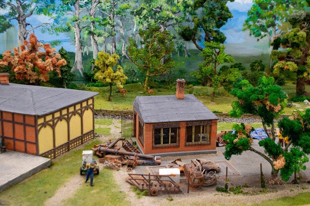 A model house with a building and a building with a cannon on the roof.