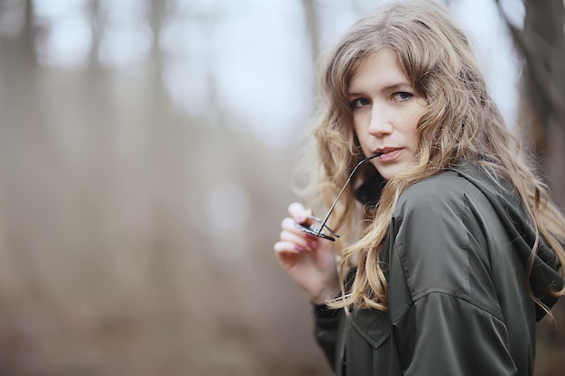 model late autumn in the park, european style adult girl in seasonal glamorous look