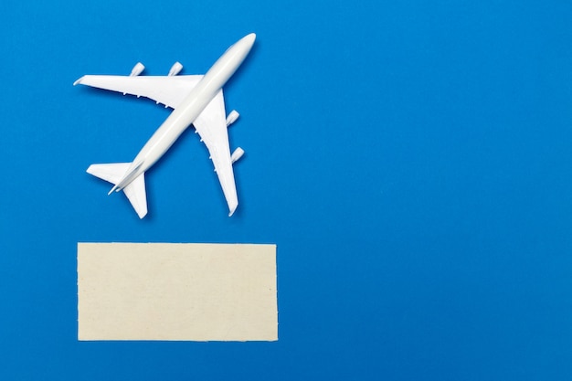 Model of passenger plane on blue background