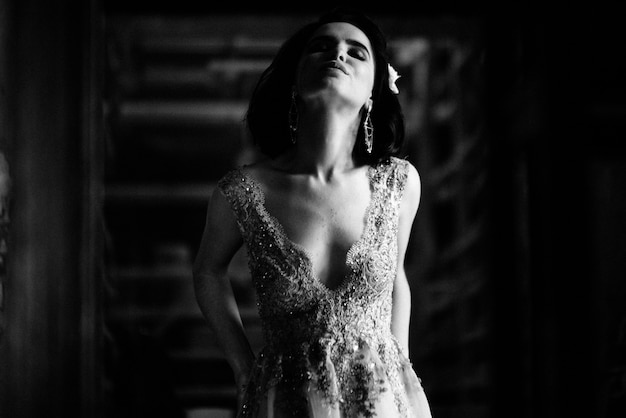 Model posing in a white long wedding dress