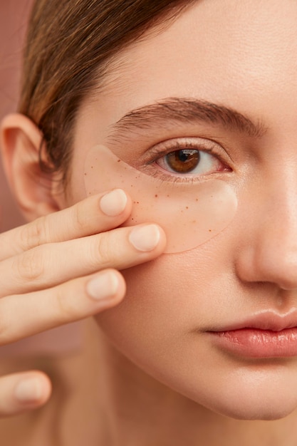 Model wearing eye patches close up