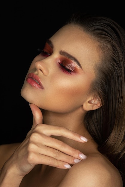 A model with a red eye makeup