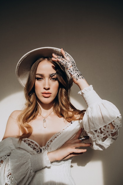 Model woman with hat and jewelry