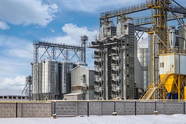 Modern agroprocessing plant for processing and silos for drying cleaning and storage of agricultural products flour cereals and grain in snow of winter field