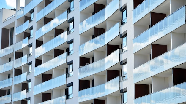 Modern apartment building on a sunny day with a blue sky Facade of a modern apartment building