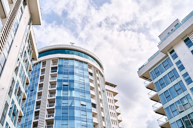 Modern apartment buildings against the backdrop of a cloudy sky